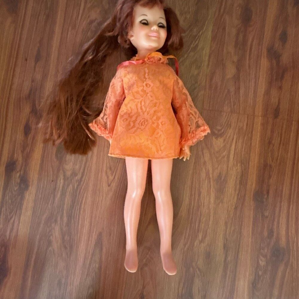 Vintage 1969 Crissy doll. Orange dress growing hair long hair to Bob.